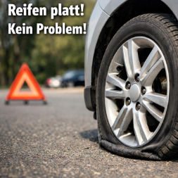 Man sieht einen Platten Reifen eines Autos.
